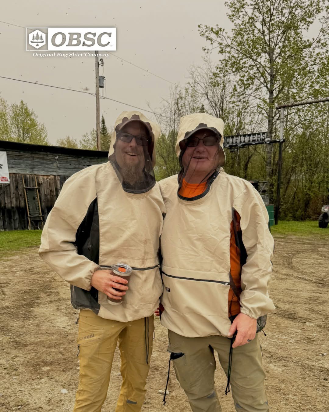 Two hunters wearing beige Original Bug Shirts with mesh hoods at Huntoba Outfitters bear camp in Ontario
